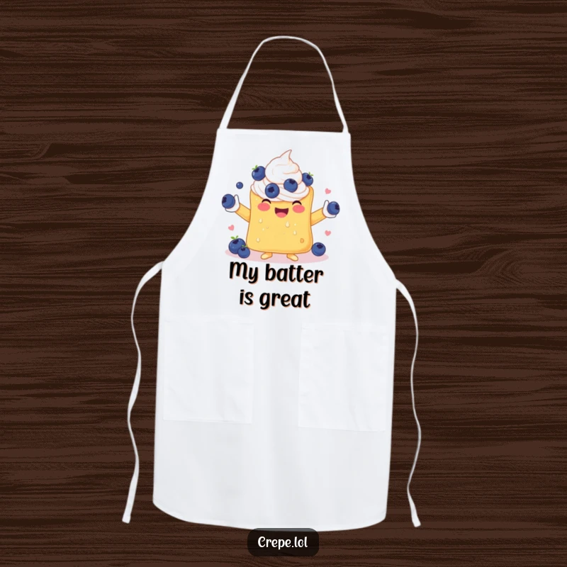 Funny apron featuring a happy crepe with whipped cream arms, skillfully juggling blueberries while cooking up smiles.