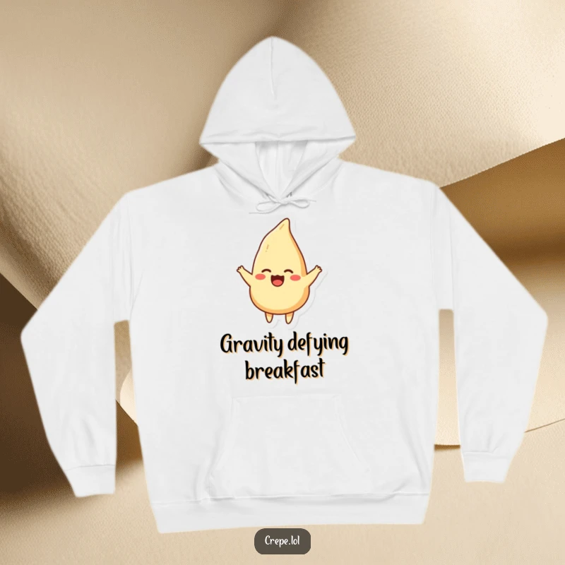Funny hoodie depicting a happy crepe mid-flip, conveying a sense of playful delight and culinary fun.