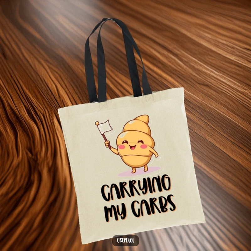 Funny croissant tote bag featuring a smiling, winking character waving a flag, designed for stylish and humorous carrying.